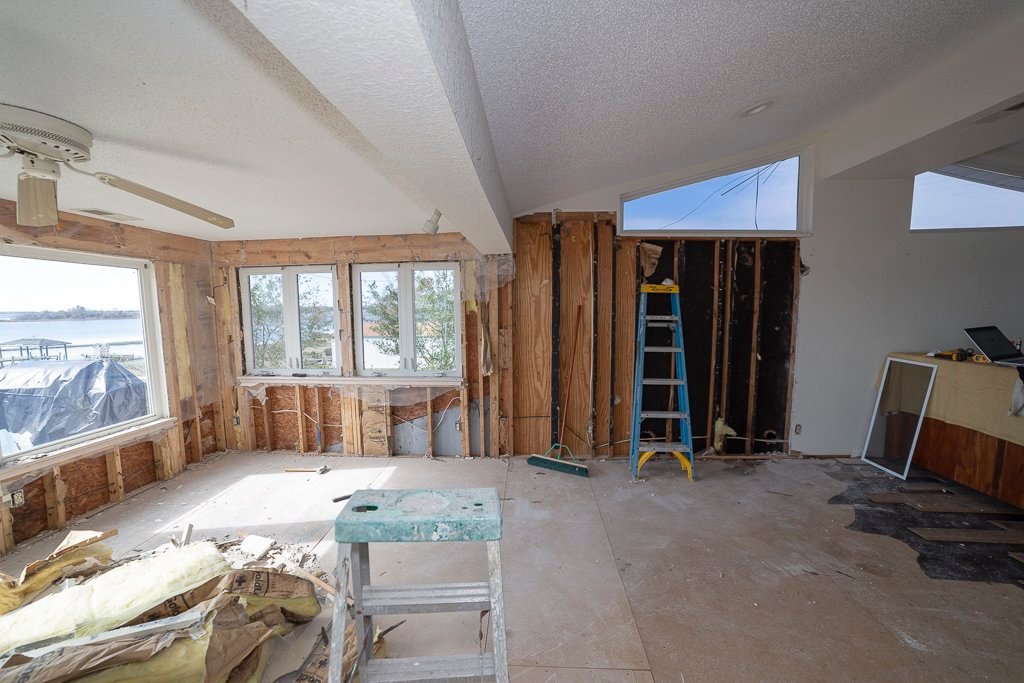 house damaged in Hurricane Florence with water damage during demolition and exposed stud wall framing and subfloor