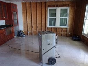 dehumidifier running to dry room before restoration